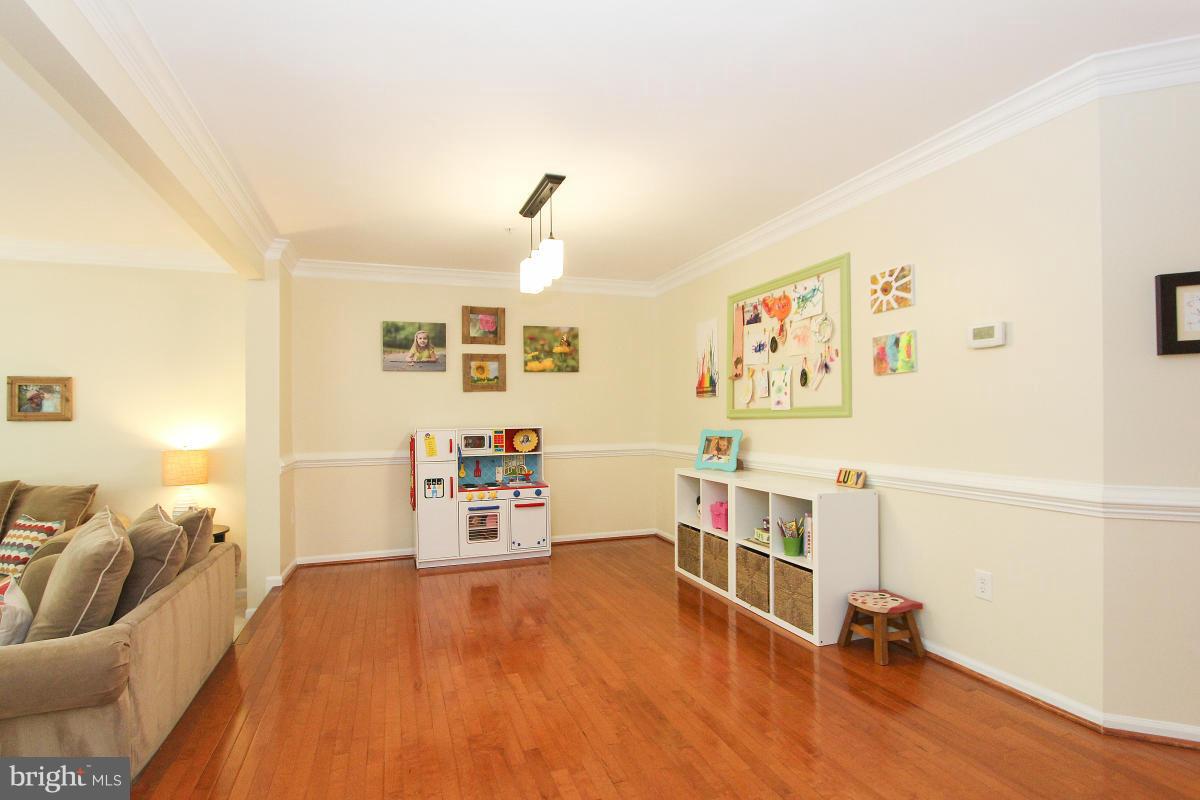 12666 Granite Ridge Drive North Potomac, MD 20878 - Photo 5 of 30 a bedroom with furniture and a wooden floor