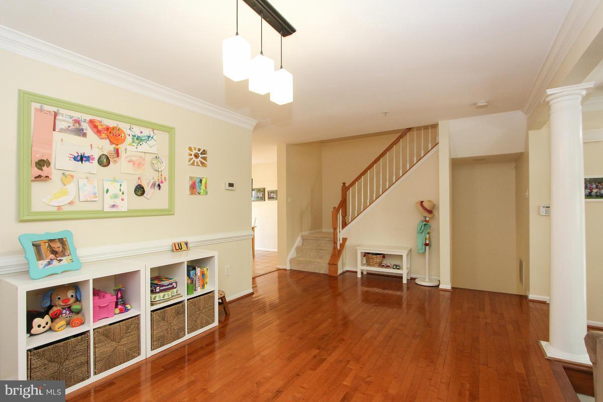 12666 Granite Ridge Drive North Potomac, MD 20878 - Photo 7 of 30 a view of a hallway with wooden floor and entryway