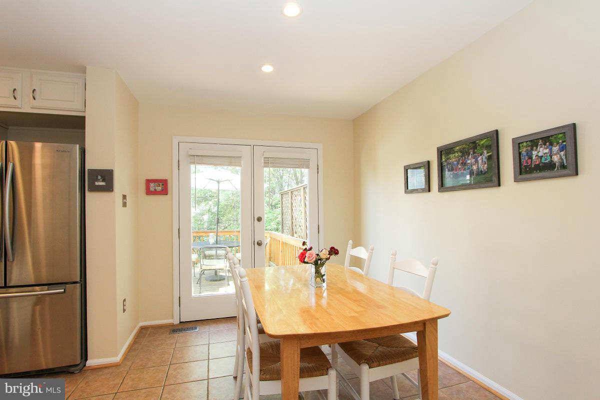 12666 Granite Ridge Drive North Potomac, MD 20878 - Photo 9 of 30 a view of a dining room with furniture window and wooden floor