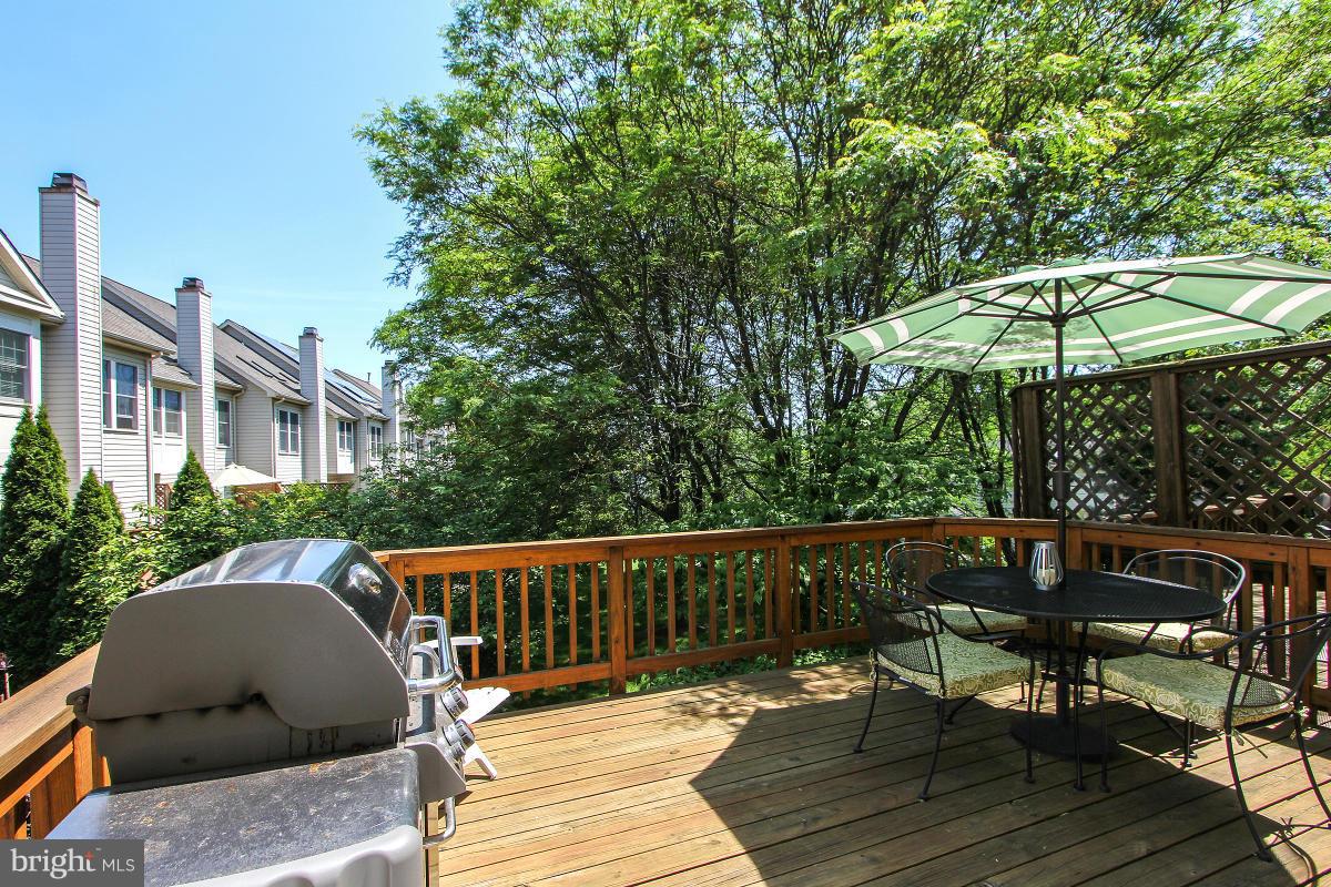 12666 Granite Ridge Drive North Potomac, MD 20878 - Photo 10 of 30 a view of balcony with wooden floor and outdoor seating