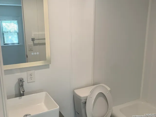 a bathroom with a sink and a vanity