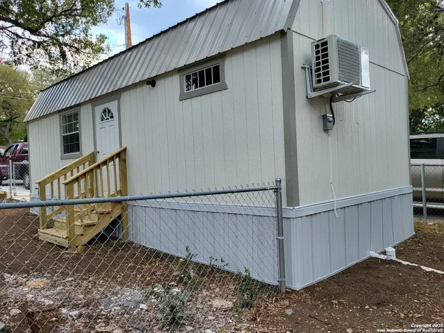 a view of balcony with wooden fence