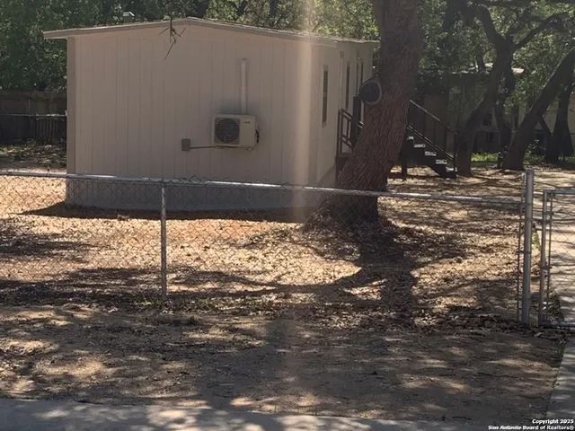 a view of a backyard of the house