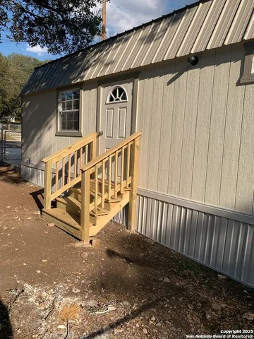 a view of an house with a yard