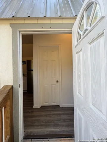 a kitchen with a refrigerator and a sink