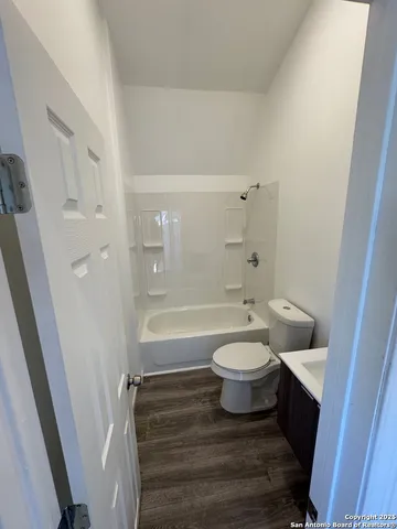 an empty room with wooden floor