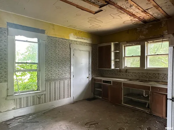 a kitchen with stainless steel appliances granite countertop a stove and a sink