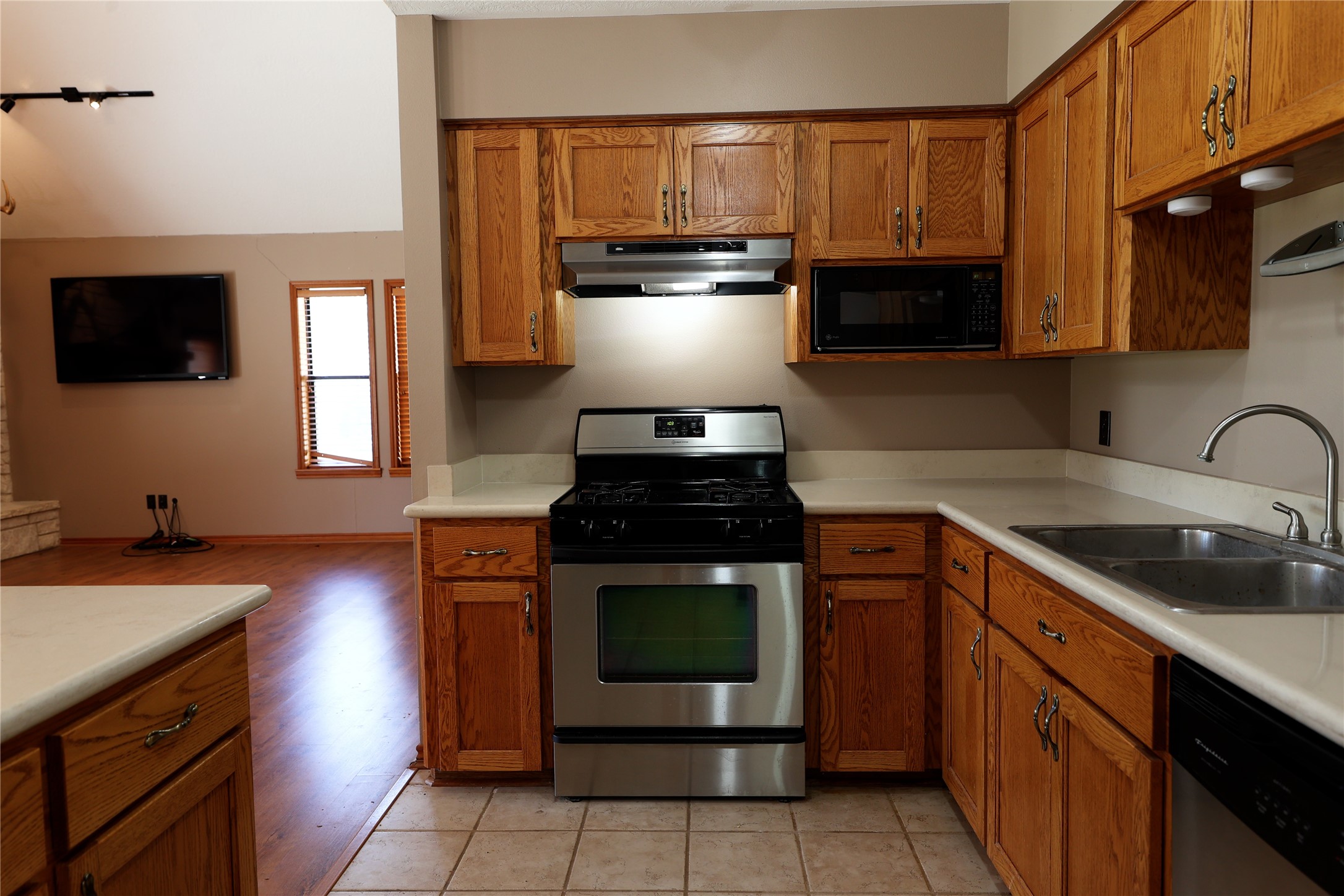 3337 Brunes Mill Road Columbus, TX 78934 - Photo 8 of 48 a kitchen with stainless steel appliances granite countertop a stove a sink and a microwave