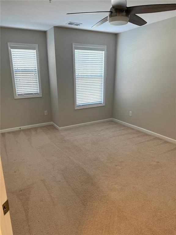 1219 Fischer Trace Cumming, GA 30041 - Photo 17 of 20 an empty room with windows and closet
