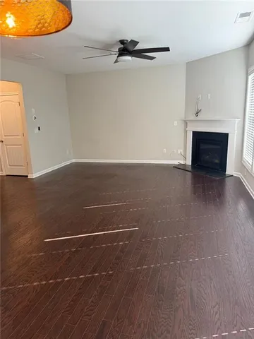 a view of a room with wooden floor
