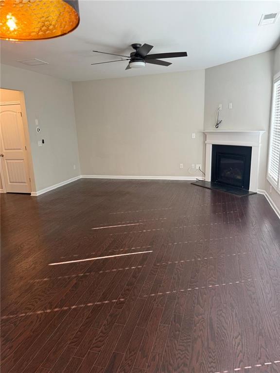 1219 Fischer Trace Cumming, GA 30041 - Photo 7 of 20 a view of a room with wooden floor