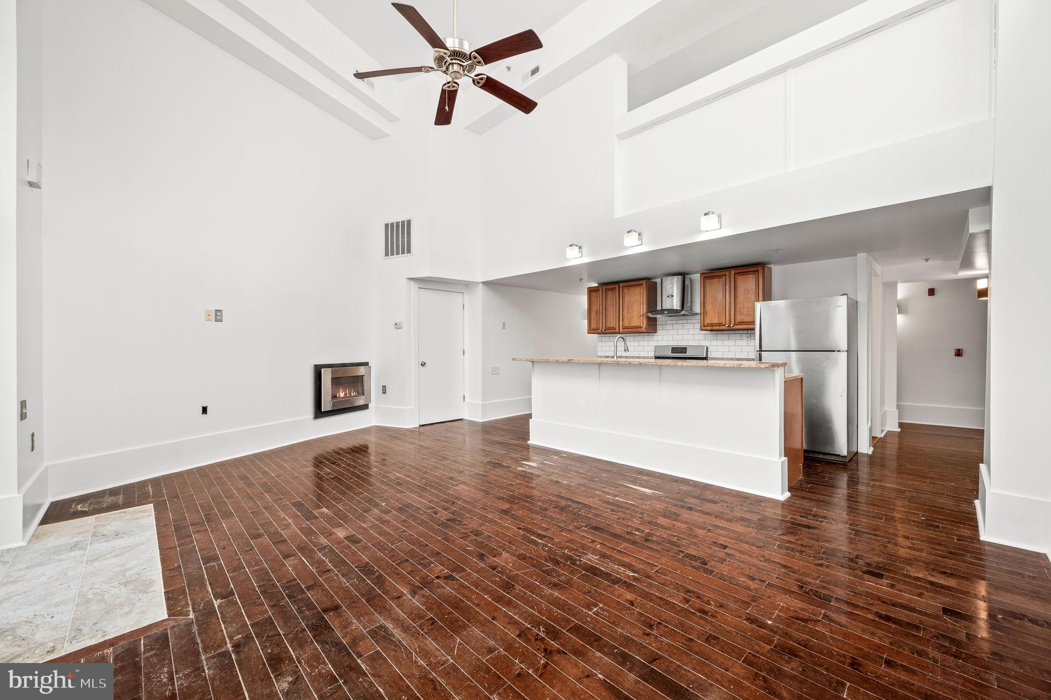 1201 South 5th Street, Unit B Philadelphia, PA 19147 - Photo 2 of 17 Living Room/Dining Room with 2-Story Ceilings