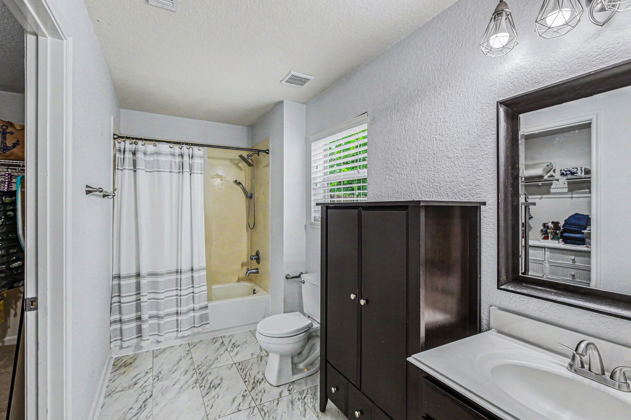 2903 Swift Brook Glen Way Spring, TX 77389 - Photo 17 of 30 Primary bathroom with a combination tub and shower and a huge walk-in closet.