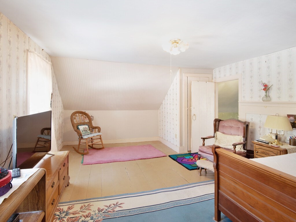 700 Mason Road Holden, MA 01522 - Photo 21 of 35 a room with a bed and a flat screen tv