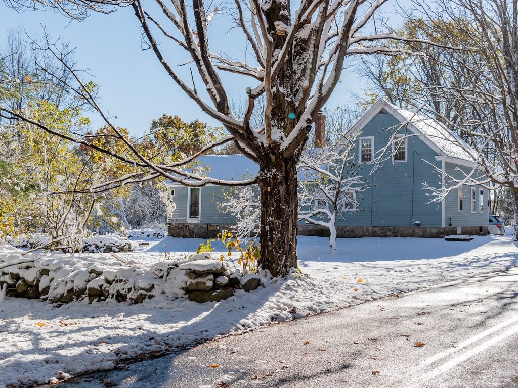 700 Mason Road Holden, MA 01522 - Photo 7 of 35 a view of a house with a yard covered in snow