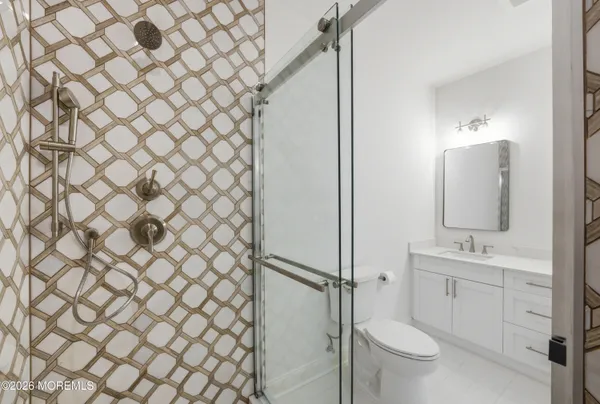 a bathroom with a toilet and a sink