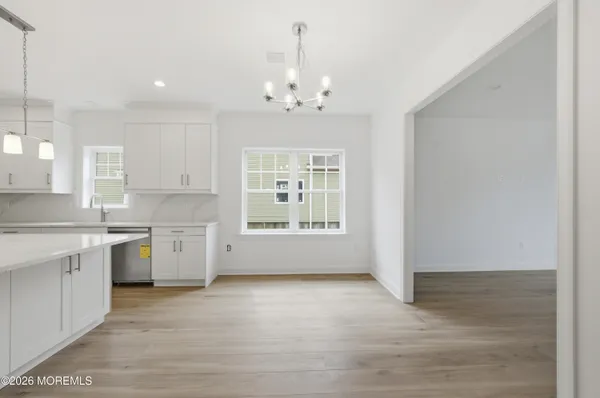 a view of a kitchen with granite countertop cabinets and a sink
