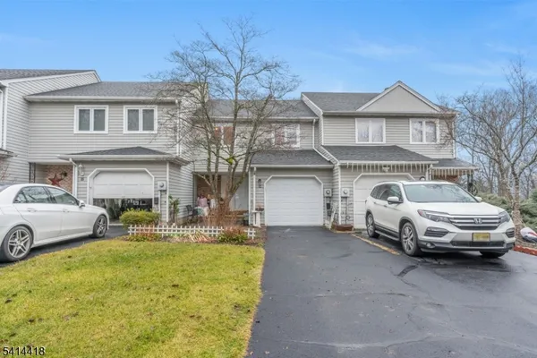 a car parked in front of a house