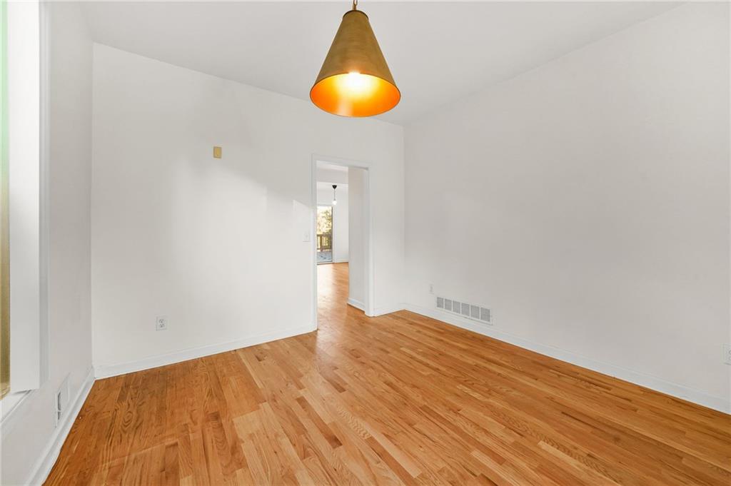 1086 Pine Grove Avenue Northeast Brookhaven, GA 30319 - Photo 13 of 33 a view of empty room with wooden floor