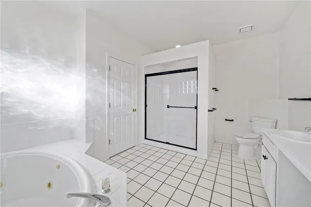 a bathroom with a bathtub and toilet