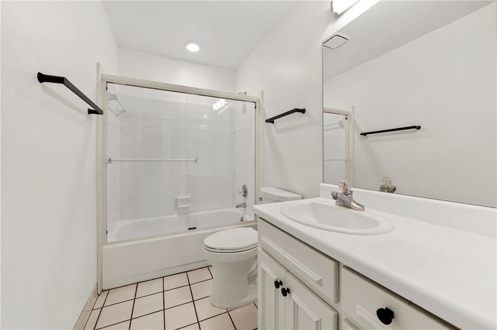1086 Pine Grove Avenue Northeast Brookhaven, GA 30319 - Photo 23 of 33 a bathroom with a sink a toilet and shower