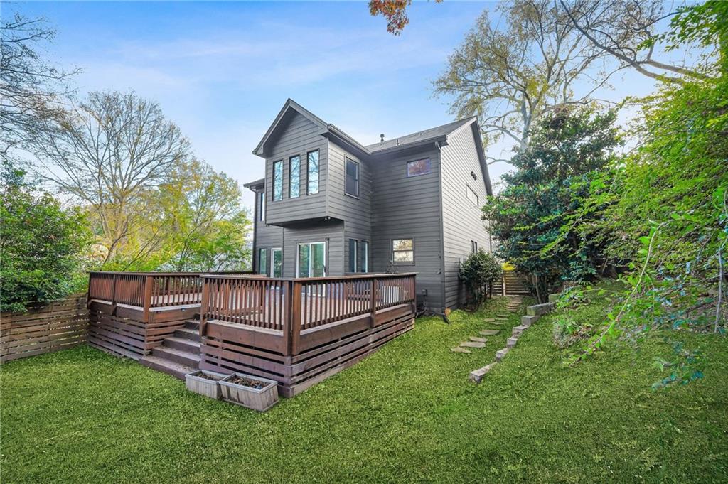 1086 Pine Grove Avenue Northeast Brookhaven, GA 30319 - Photo 30 of 33 a view of a house with a yard