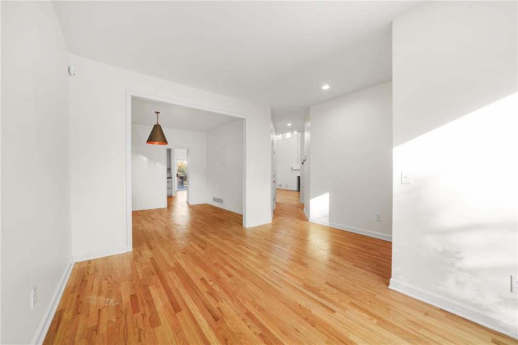 1086 Pine Grove Avenue Northeast Brookhaven, GA 30319 - Photo 4 of 33 a view of a hallway with wooden floor