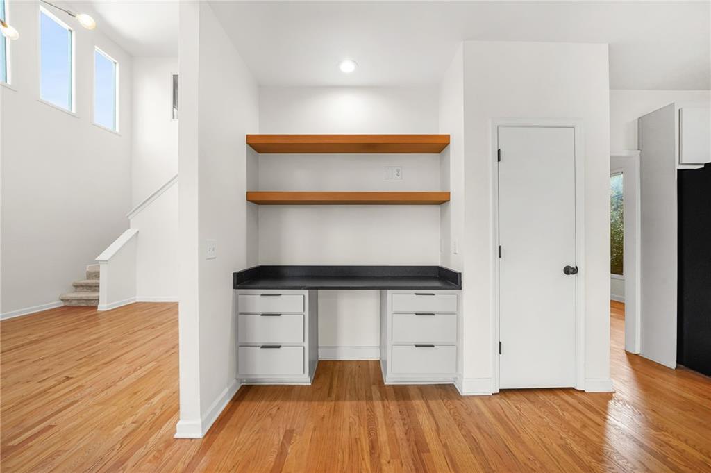 1086 Pine Grove Avenue Northeast Brookhaven, GA 30319 - Photo 8 of 33 a kitchen with stainless steel appliances wooden floor and more cabinets
