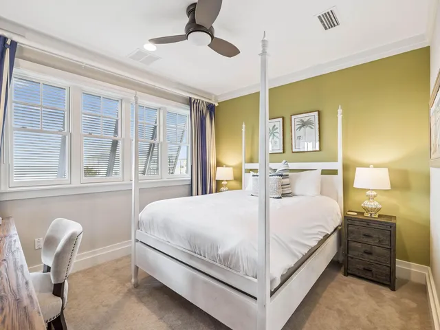 a bedroom with a bed and a chair