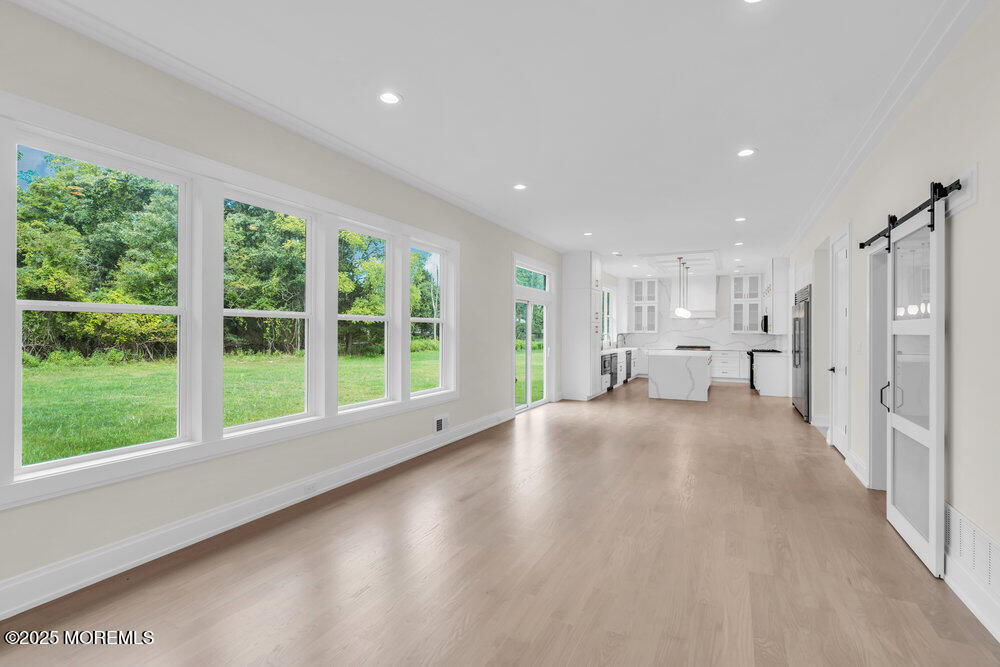1730 Old Freehold Road Toms River, NJ 08755 - Photo 17 of 41 a view of empty room with wooden floor and windows