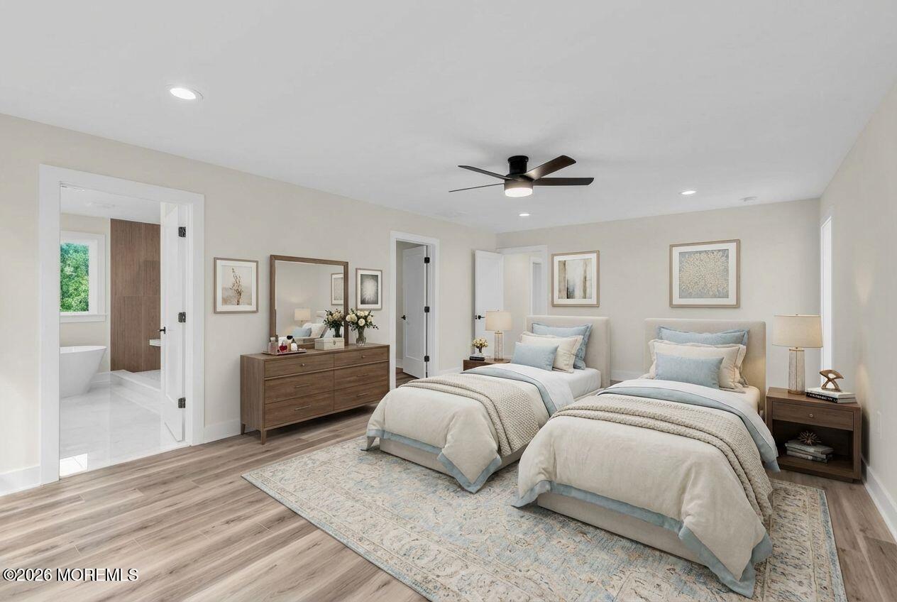 1730 Old Freehold Road Toms River, NJ 08755 - Photo 20 of 41 a large bedroom with a bed and a chandelier