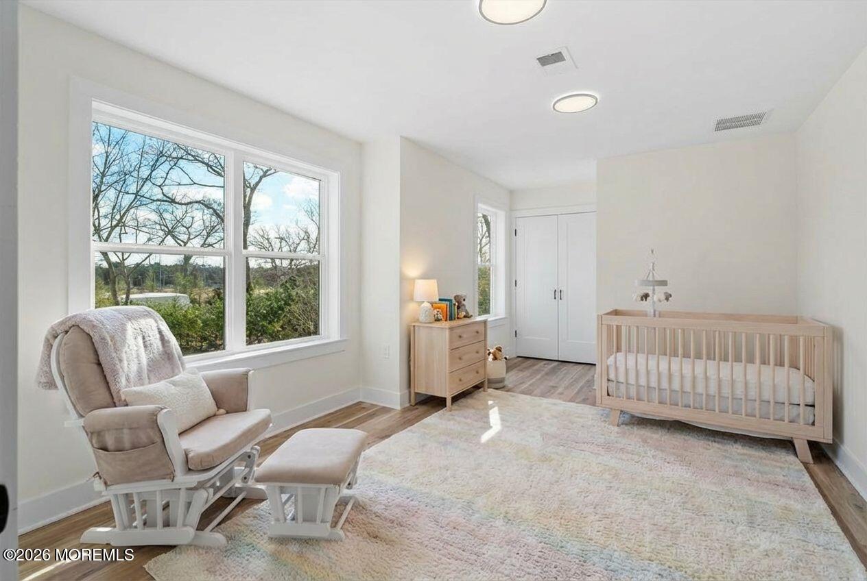 1730 Old Freehold Road Toms River, NJ 08755 - Photo 22 of 41 a bedroom with a bed and a chair