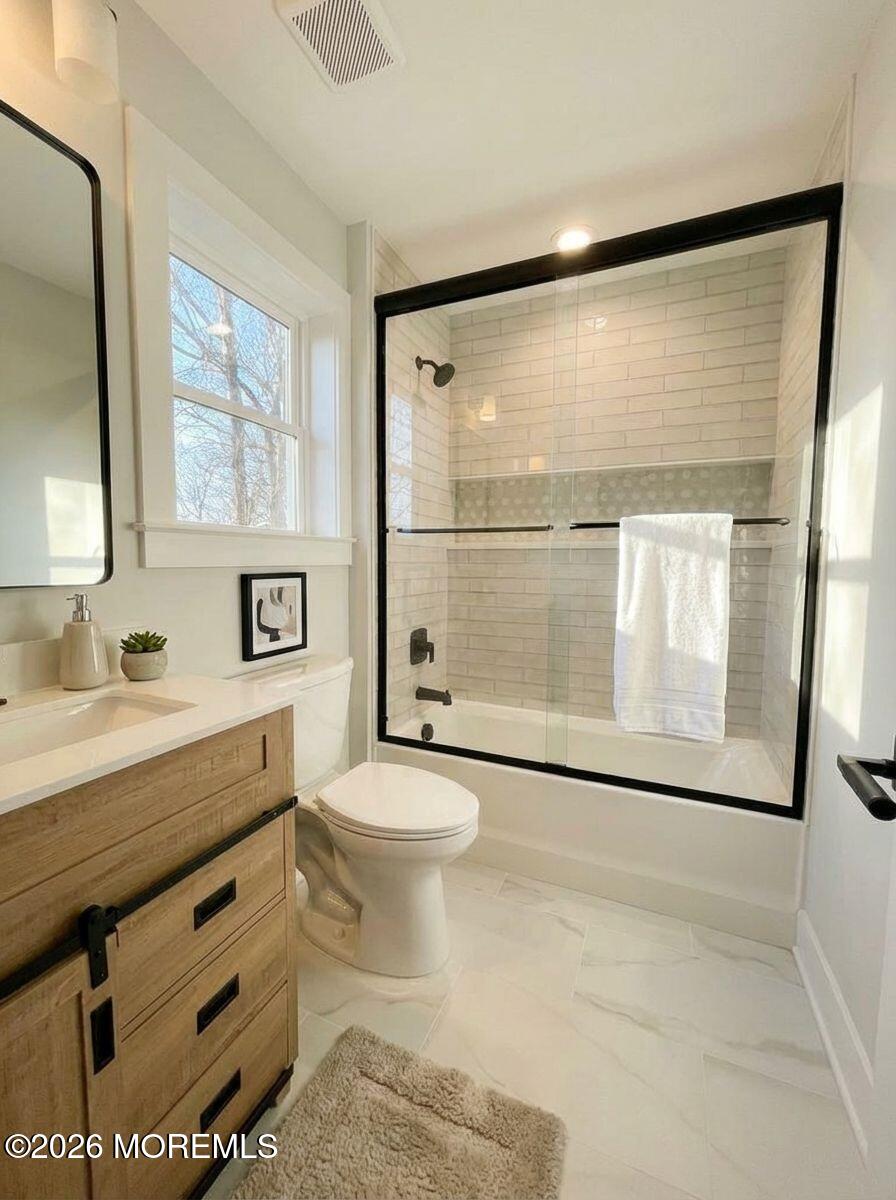1730 Old Freehold Road Toms River, NJ 08755 - Photo 30 of 41 a bathroom with a granite countertop sink mirror vanity and toilet