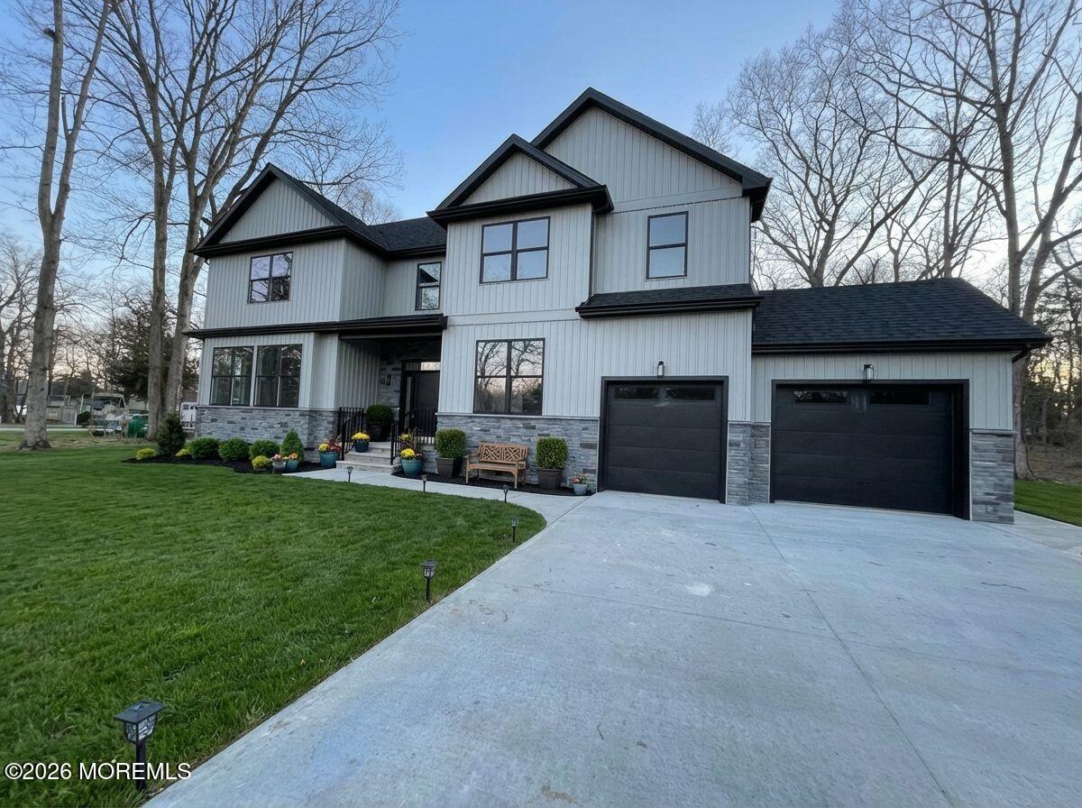 1730 Old Freehold Road Toms River, NJ 08755 - Photo 3 of 41 a front view of a house with a yard and garage