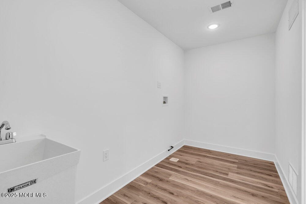 1730 Old Freehold Road Toms River, NJ 08755 - Photo 31 of 41 a view of a room with wooden floor