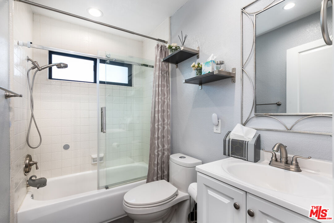 231 Bethany Road, Unit 210 Burbank, CA 91504 - Photo 11 of 22 a bathroom with a sink toilet and shower