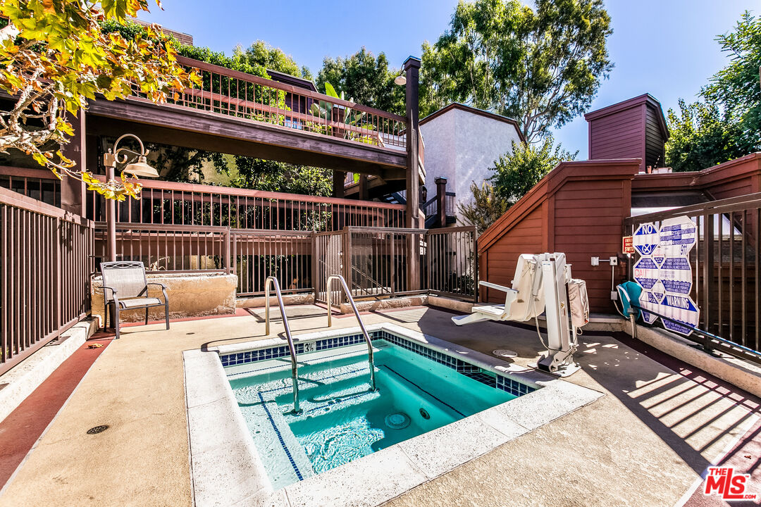 231 Bethany Road, Unit 210 Burbank, CA 91504 - Photo 21 of 22 a view of a chairs and tables in the patio
