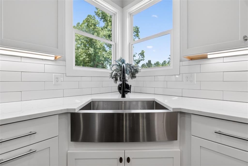 3528 North Bogan Road Buford, GA 30519 - Photo 12 of 79 a kitchen with a sink and a window