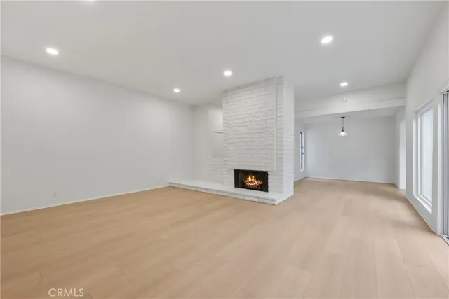 a view of an empty room with a fireplace