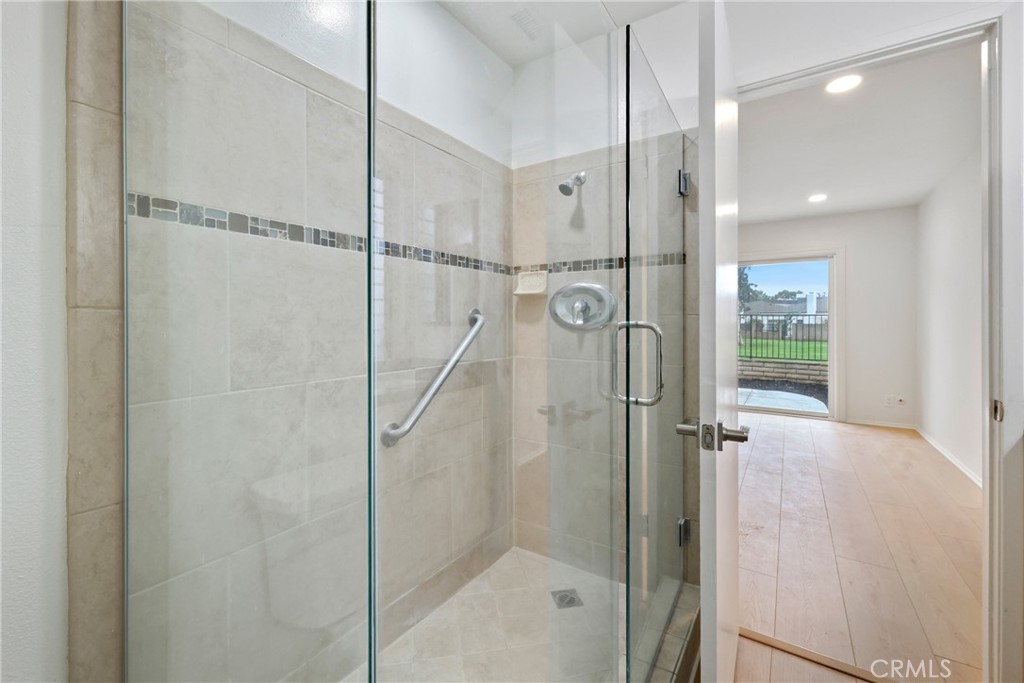 71 Seton Road Irvine, CA 92612 - Photo 11 of 22 a bathroom with a glass shower door