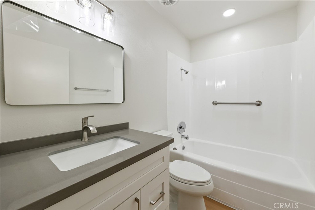 71 Seton Road Irvine, CA 92612 - Photo 14 of 22 a bathroom with a sink a toilet and a mirror