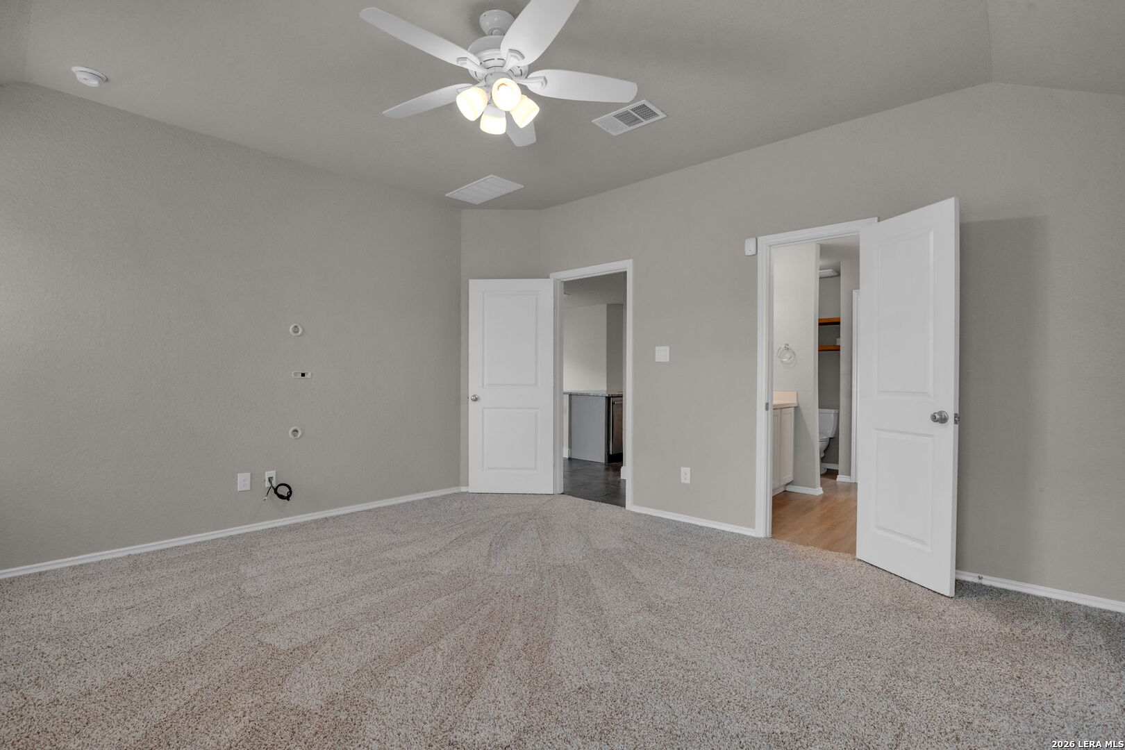 10306 Midsummer Meadow Converse, TX 78109 - Photo 12 of 26 a view of an empty room with a ceiling fan