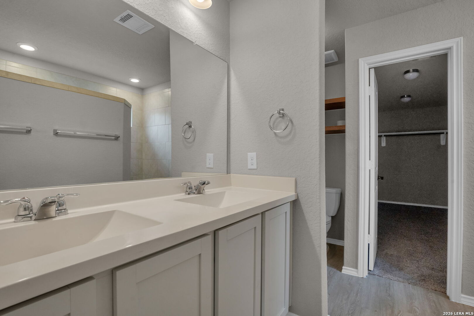 10306 Midsummer Meadow Converse, TX 78109 - Photo 13 of 26 a bathroom with a sink and a mirror