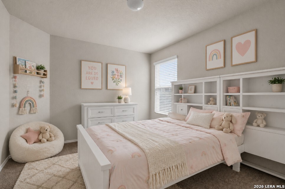 10306 Midsummer Meadow Converse, TX 78109 - Photo 14 of 26 a bedroom with a large bed and a wooden floor