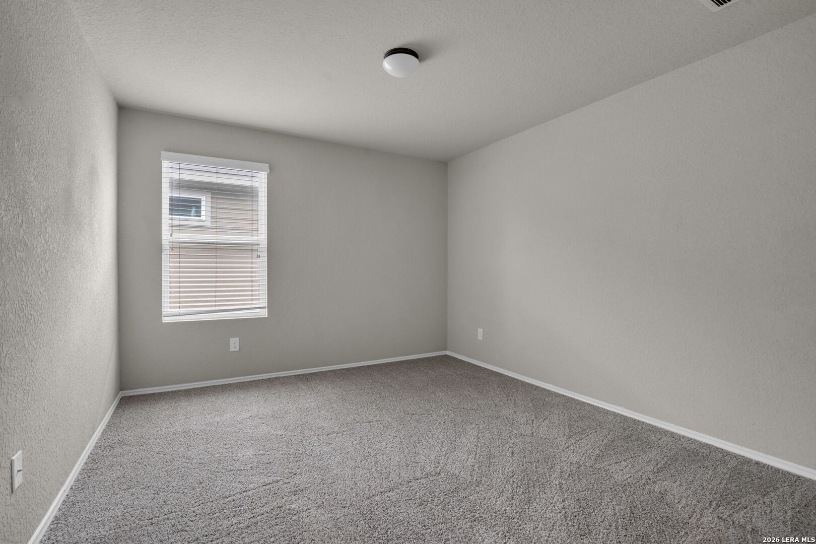 10306 Midsummer Meadow Converse, TX 78109 - Photo 19 of 26 a view of an empty room with a window