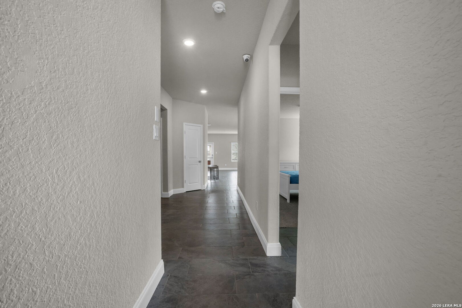 10306 Midsummer Meadow Converse, TX 78109 - Photo 21 of 26 a view of a hallway with wooden floor