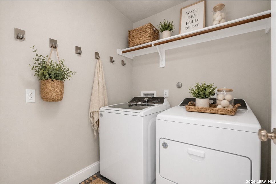 10306 Midsummer Meadow Converse, TX 78109 - Photo 22 of 26 a utility room with dryer and washer