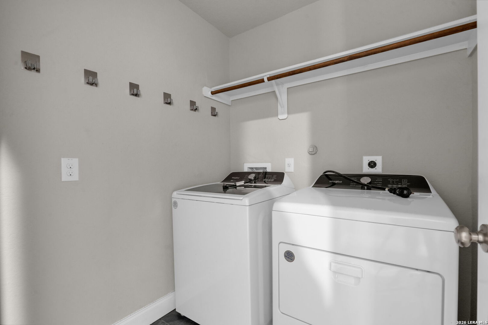 10306 Midsummer Meadow Converse, TX 78109 - Photo 23 of 26 a utility room with dryer and washer