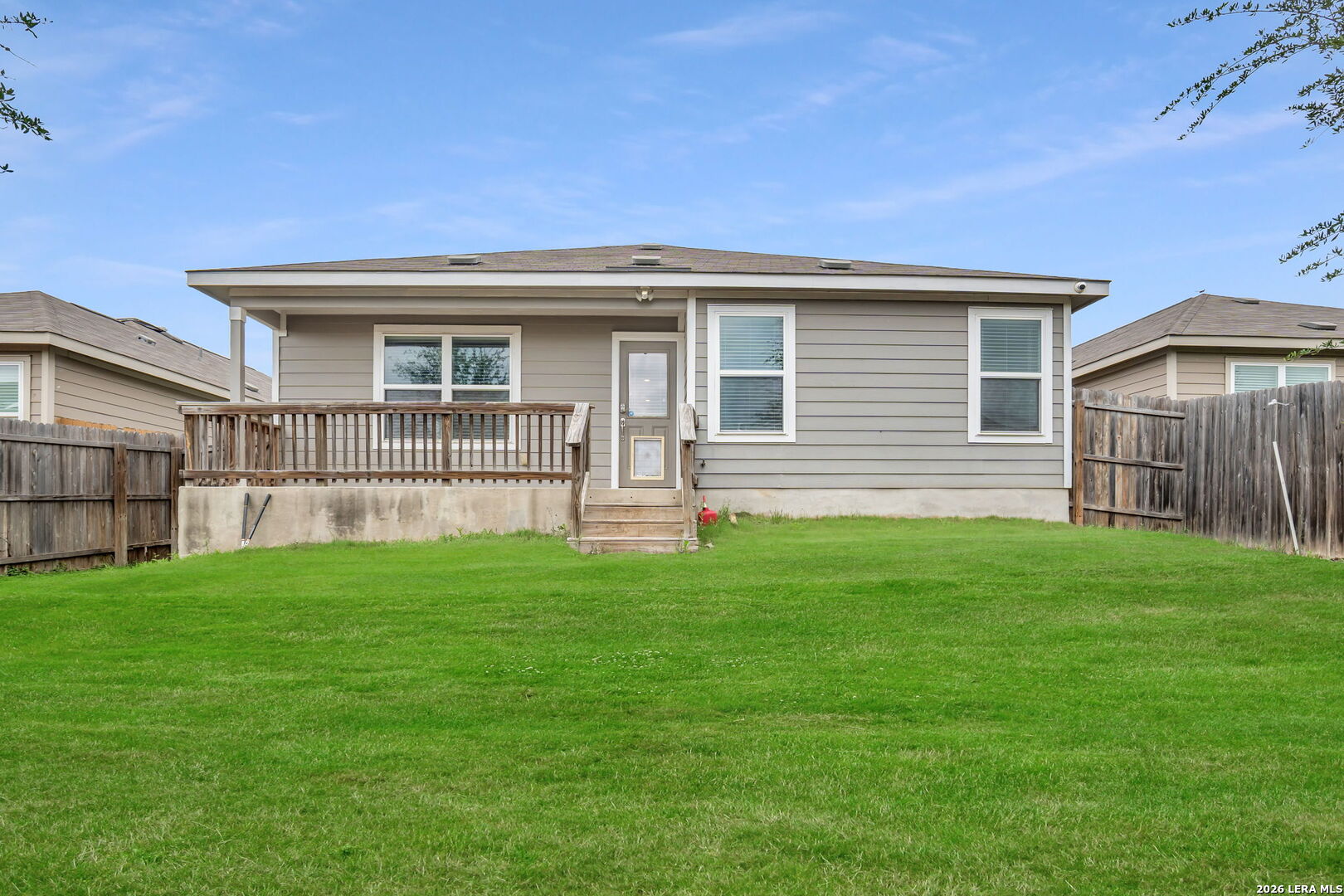 10306 Midsummer Meadow Converse, TX 78109 - Photo 25 of 26 a front view of a house with a yard
