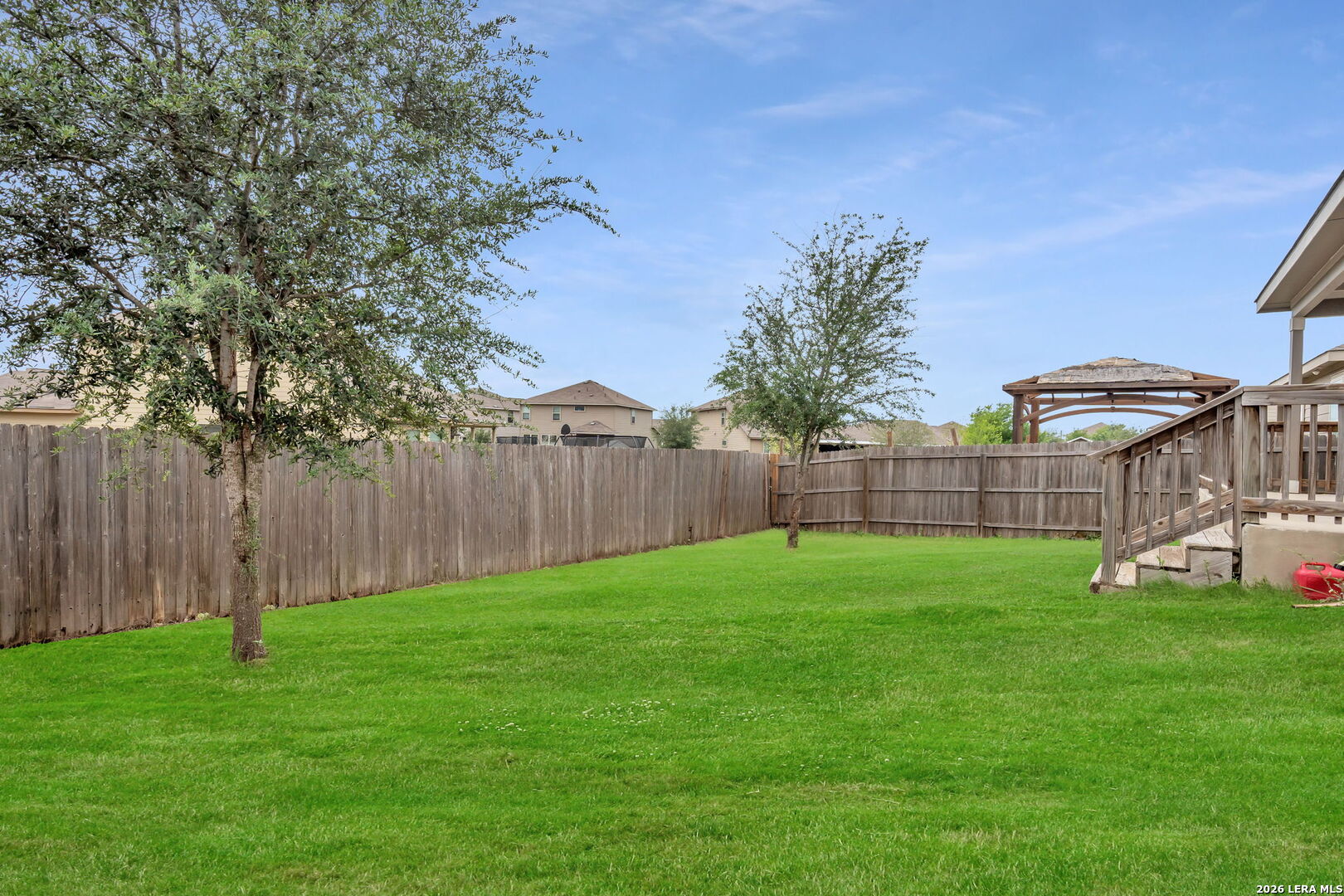 10306 Midsummer Meadow Converse, TX 78109 - Photo 26 of 26 a view of a yard with a trampoline